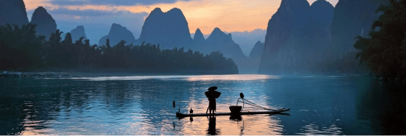A bamboo raft and karst mountains on the river in Yangshuo